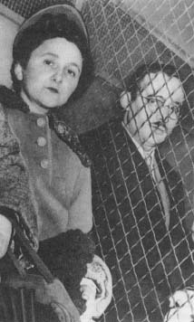 Ethel and Julius Rosenberg, separated by wire, following their conviction in March 1951. (AP/Wide World Photos)