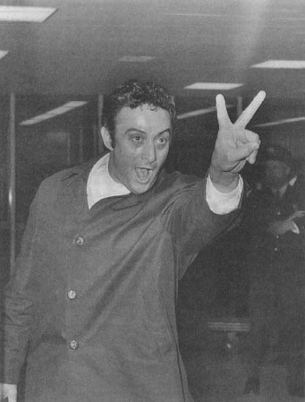 One year before his obscenity trial in New York, comedian Lenny Bruce is denied entrance to England "in the public interest." (AP/Wide World Photos)