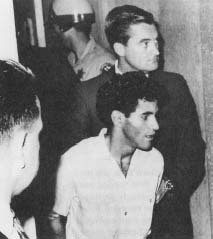 Sirhan Sirhan in custody the day after he shot Senator Robert F. Kennedy. Despite his admission of guilt, a lengthy trial followed. (API Wide World Photos)