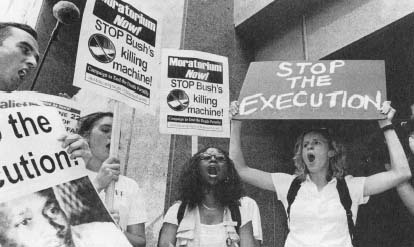 Demonstrators from the "Campaign to End the Death Penalty" protest the execution of convicted murderer Gray Graham. (Bettmann/Corbis)
