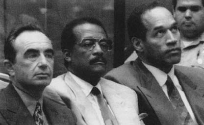 O.J. Simpson (right) in court with two of his attorneys, Robert Shapiro and Johnny Cochran. (Archive Photos)
