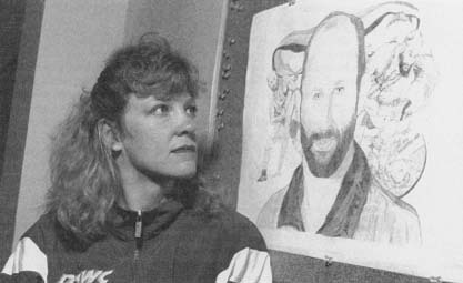 Nancy Schultz looks at drawing of her late husband David, murdered by John E. DuPont. (API Wide World Photos)