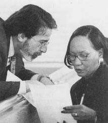 Defense attorney shows documents to Theodry Carruth, mother of professional football player, Rae Carruth, on trial for murdering his pregnant girlfriend. (AP/Wide World Photos)